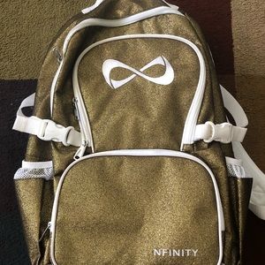 Gold and White Nfinity Backpack .